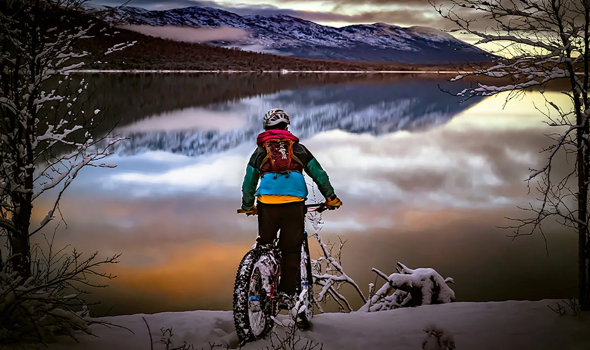 industry nine fat bike rider in front of a lake