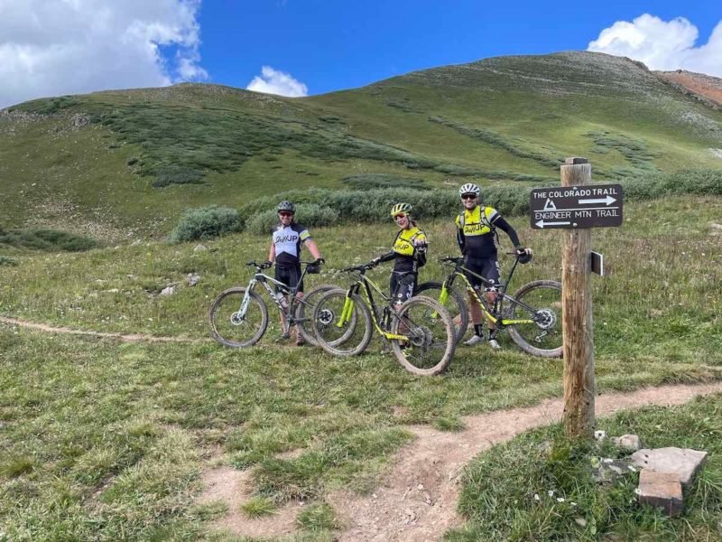 bikerumor pic of the day a group of cyclists on a dirt trail along a large grassy mountain trail