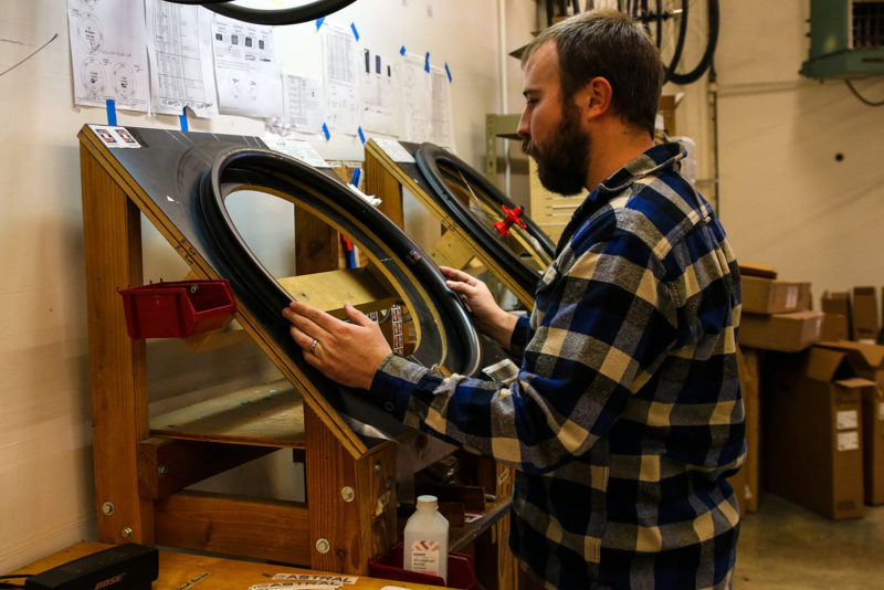 Alec White examining an Astral Cycling carbon rim