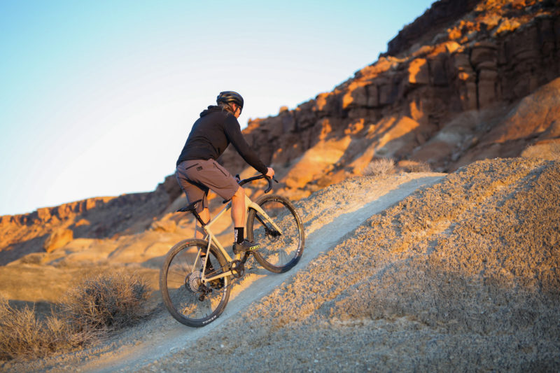 ENVE MOG gravel bike being ridden up a hill in the desert