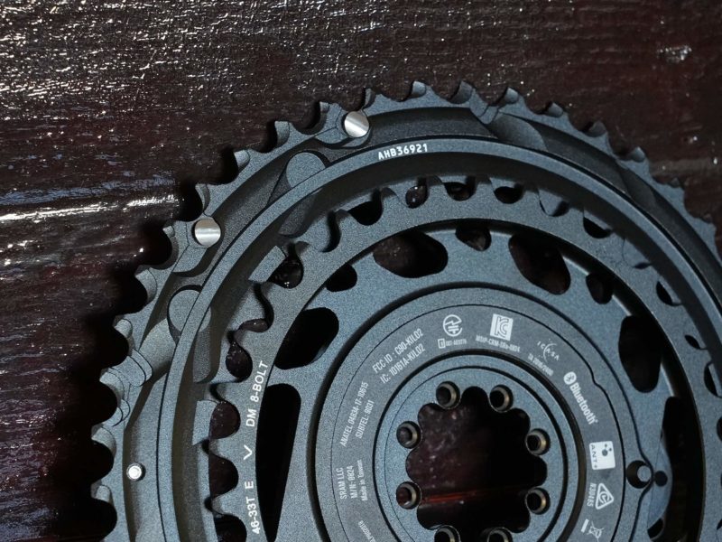 closeup of sram force one-piece 2x chainring unit with Quarq power meter