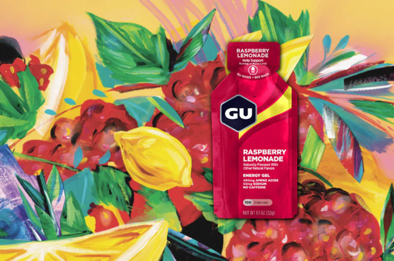 GU Raspberry Lemonade gel packet on a floral art background