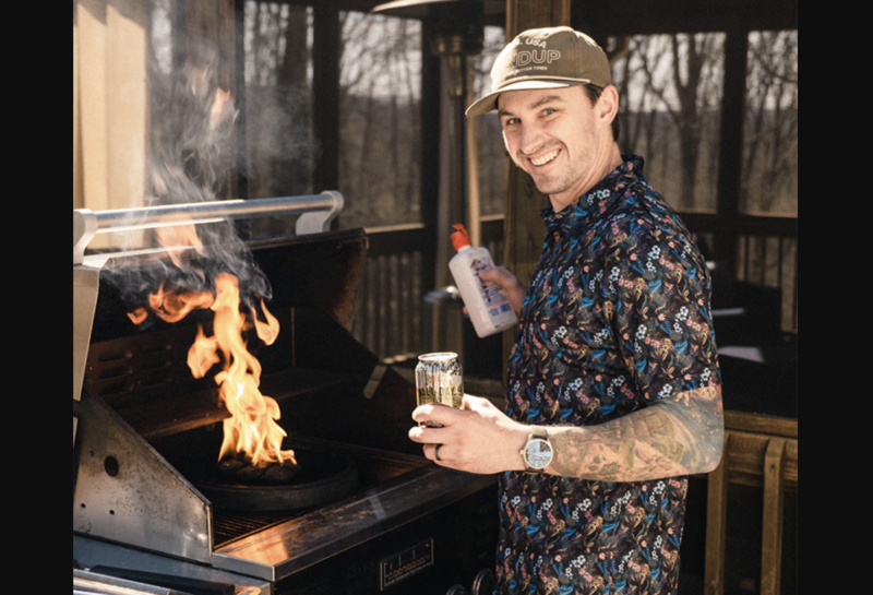 man in hawaiian shirt grilling