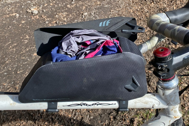 Tailfin Top Tube Packs small rackless bikepacking bag storage review, 1.1L Flip Lid stuffed full