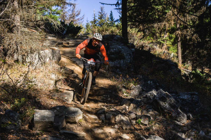 a man navigates a technical section of trail on an eMTB