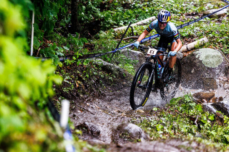 kate courtney racing in ultra wet conditions world cup xc maxxis severe tire testing