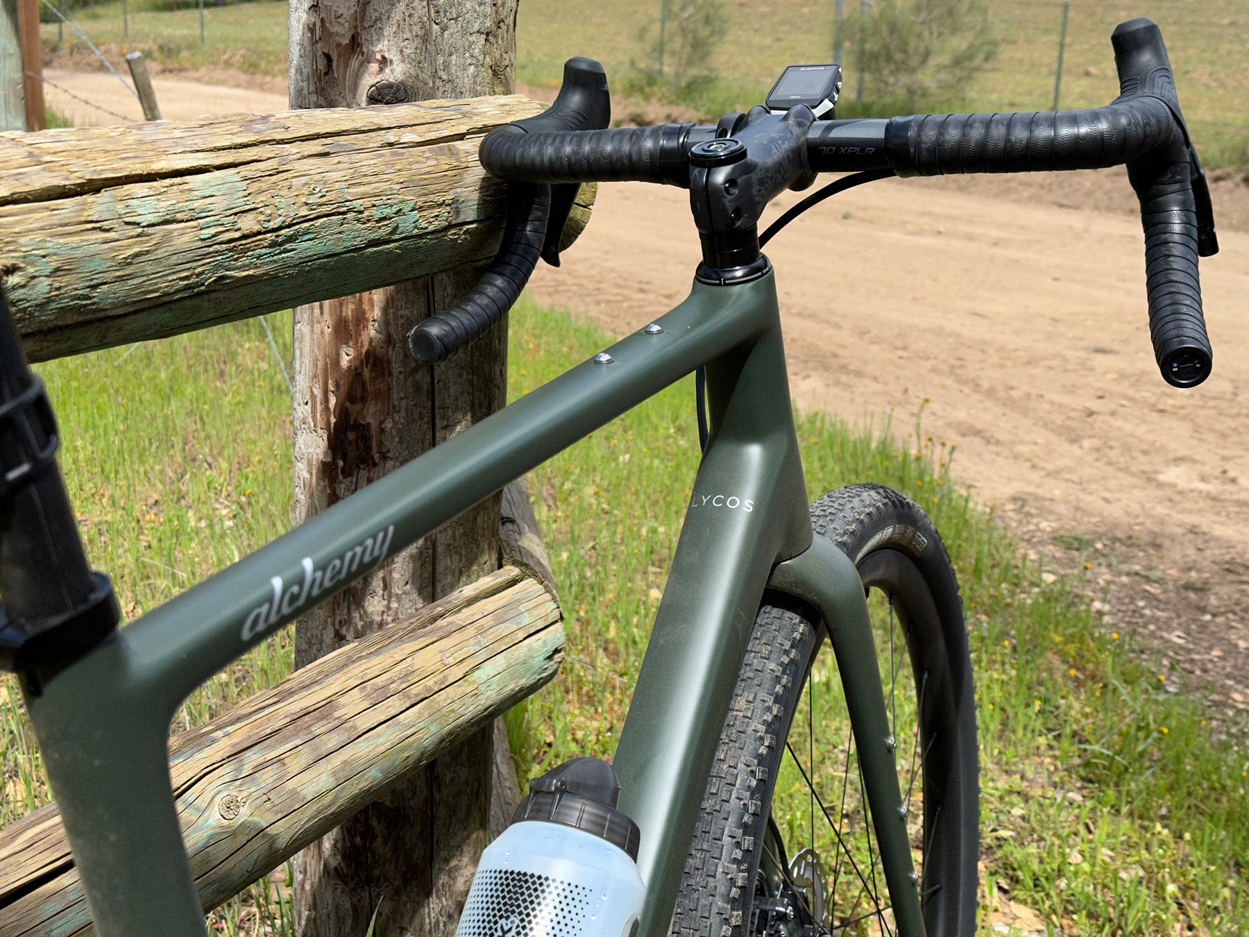 alchemy lycos gravel bike review with closeup details of headtube and top tube bag mounts