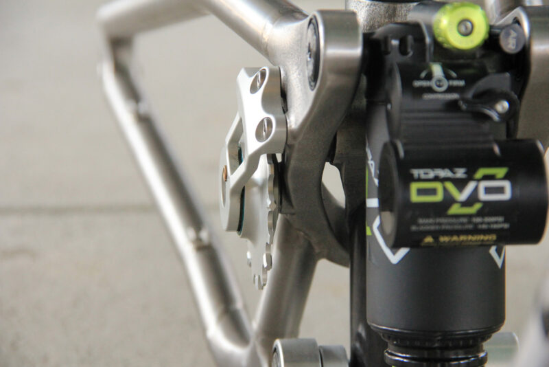 deviate cycles titanium downcountry bike idler pulley on swingarm