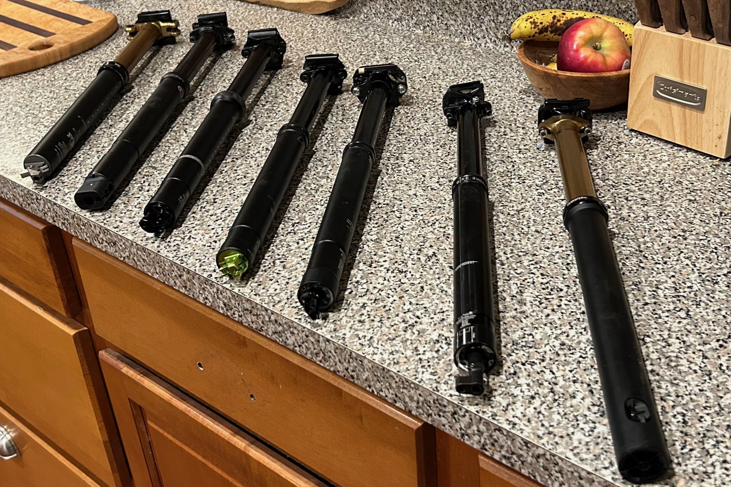 Dropper posts lined up on a counter
