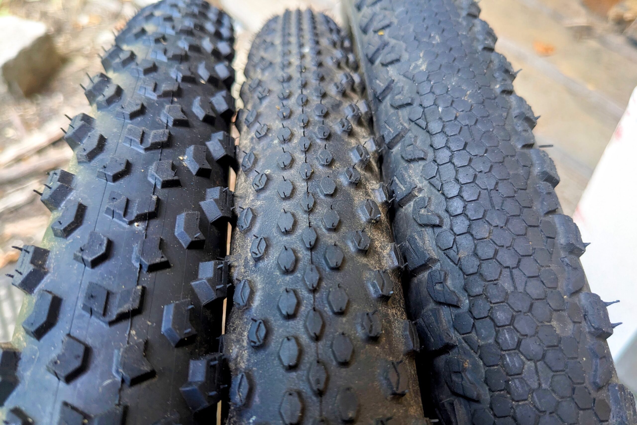 Comparison shot of three different gravel bike tire treads