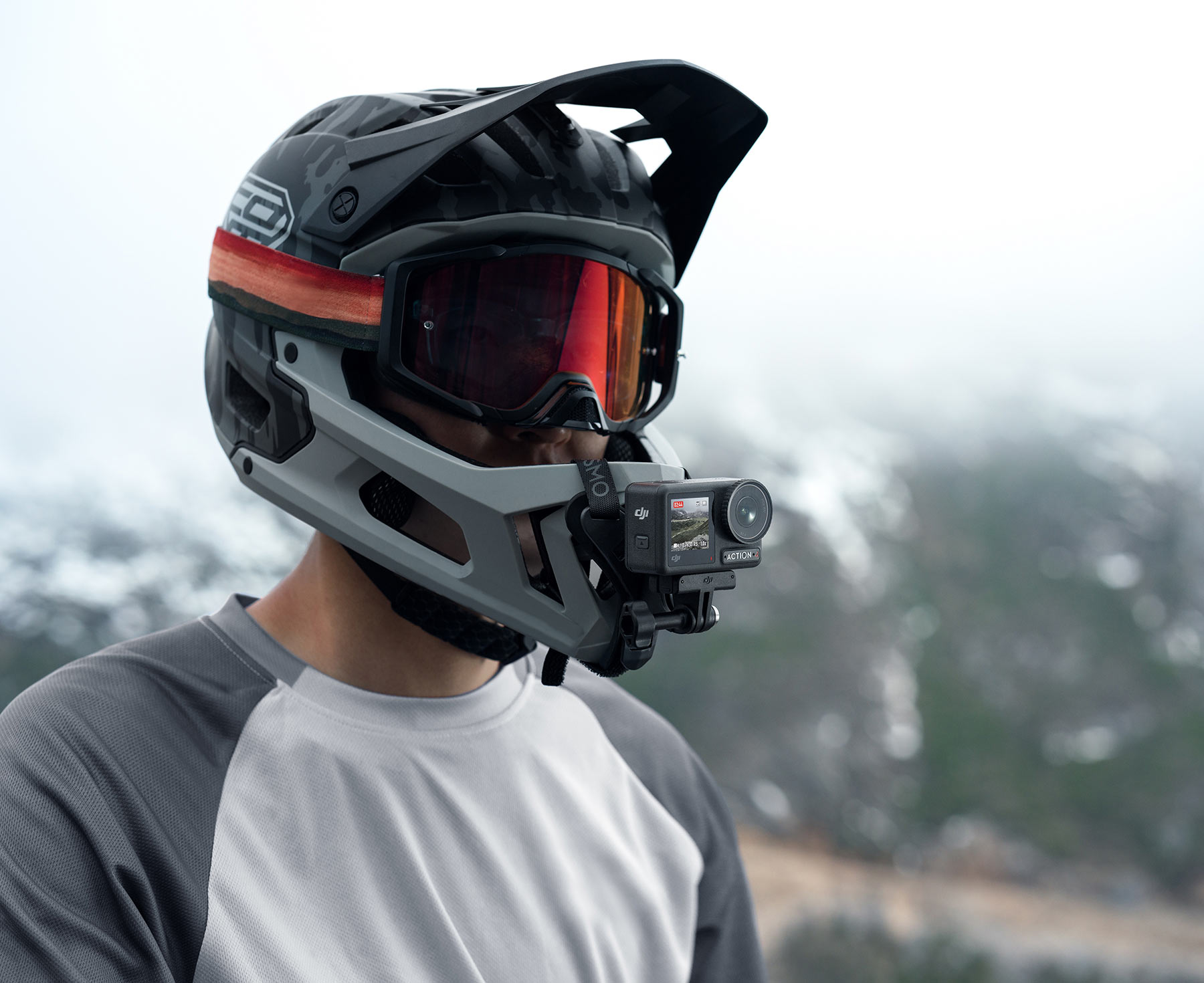 DJI Osmo Action 4 camera shown on MTB helmet