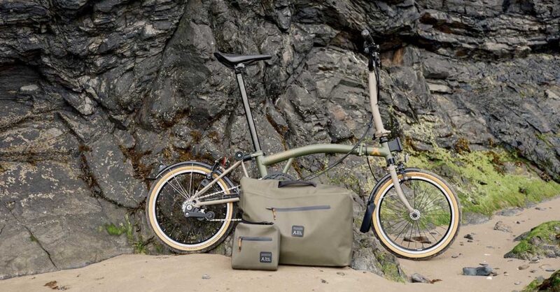 Brompton x Bear Grylls C Line Explore against the cliff