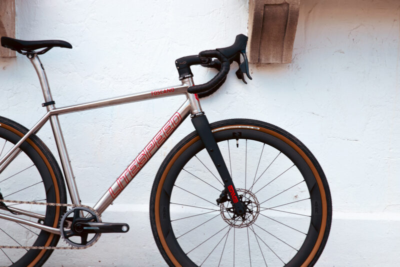 litespeed toscana titanium gravel bike leaning against a wall