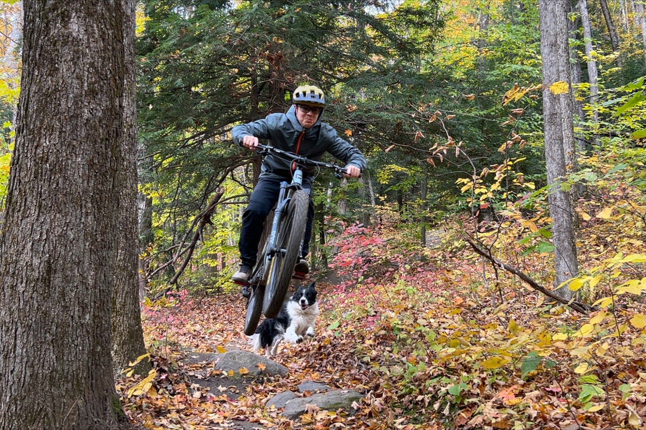 Testing mountain bike jackets on the trail with fall foliage