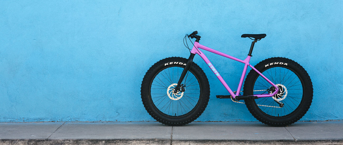 State Bicycle Co. 6061 Trail+ Fat Bike, an affordable alloy budget entry-level aluminum fatbike, BAAW purple on blue