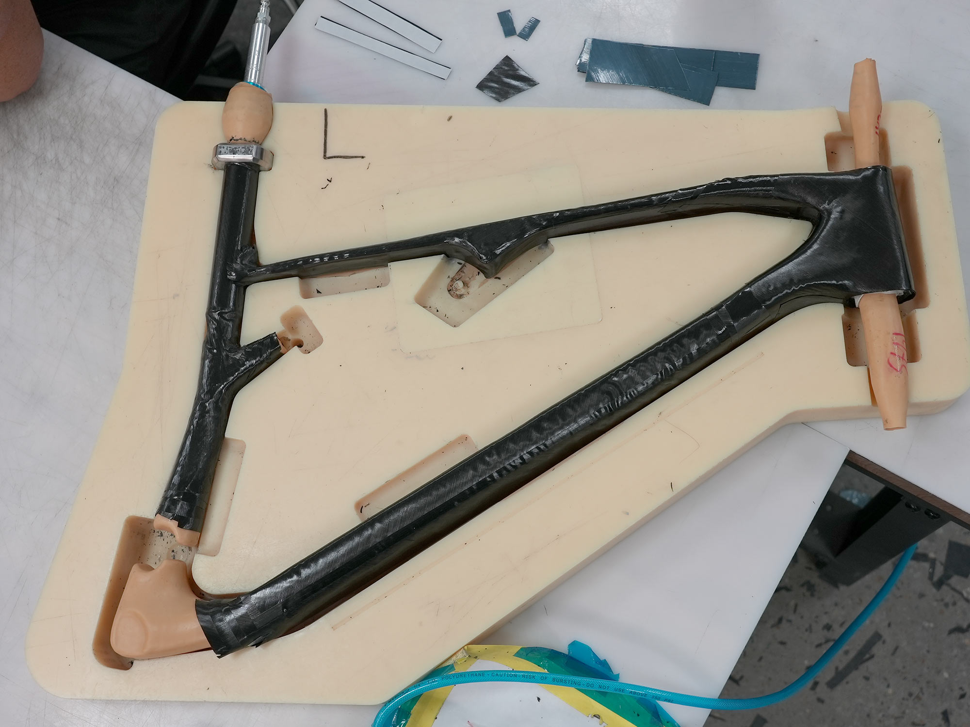 allied cycles carbon frame parts before molding
