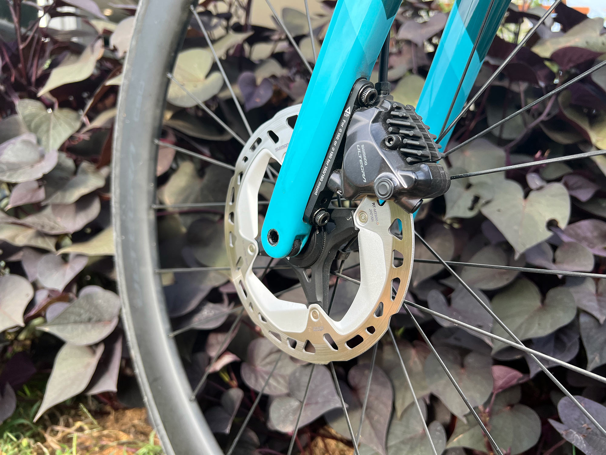 closeup details of shimano ultegra R8100 12-speed road bike front brakes