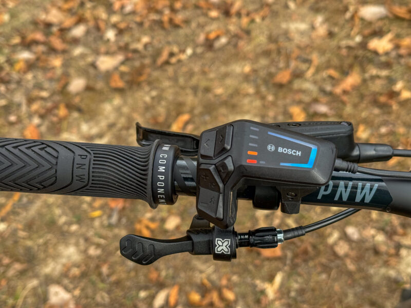 orange bars on REI Co-Op Cycles e3.1 eMTB remote