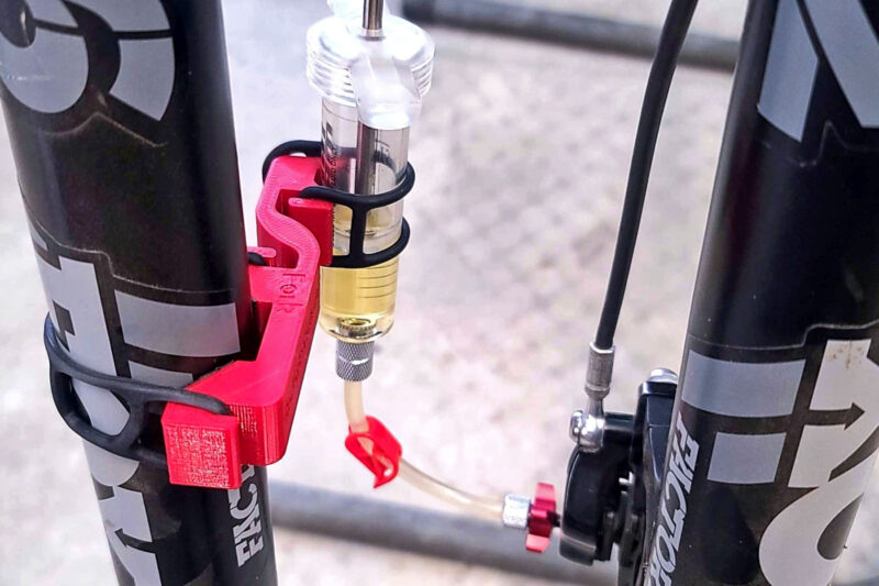 RedSide Hydraulic Bleed Syringe Holder, a 3rd Hand Brake Tool for Modern Bike Mechanics