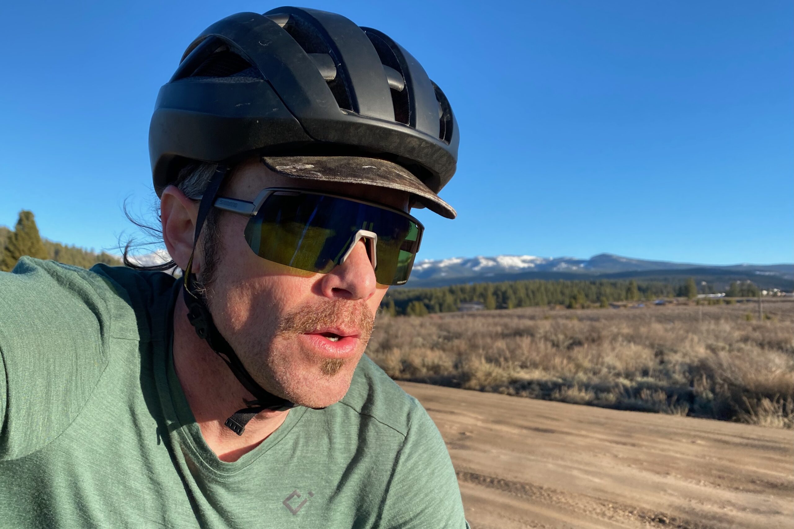 Riding in the Shimano Technium L sunglasses with the Ridescape GR lenses on a gravel bike.