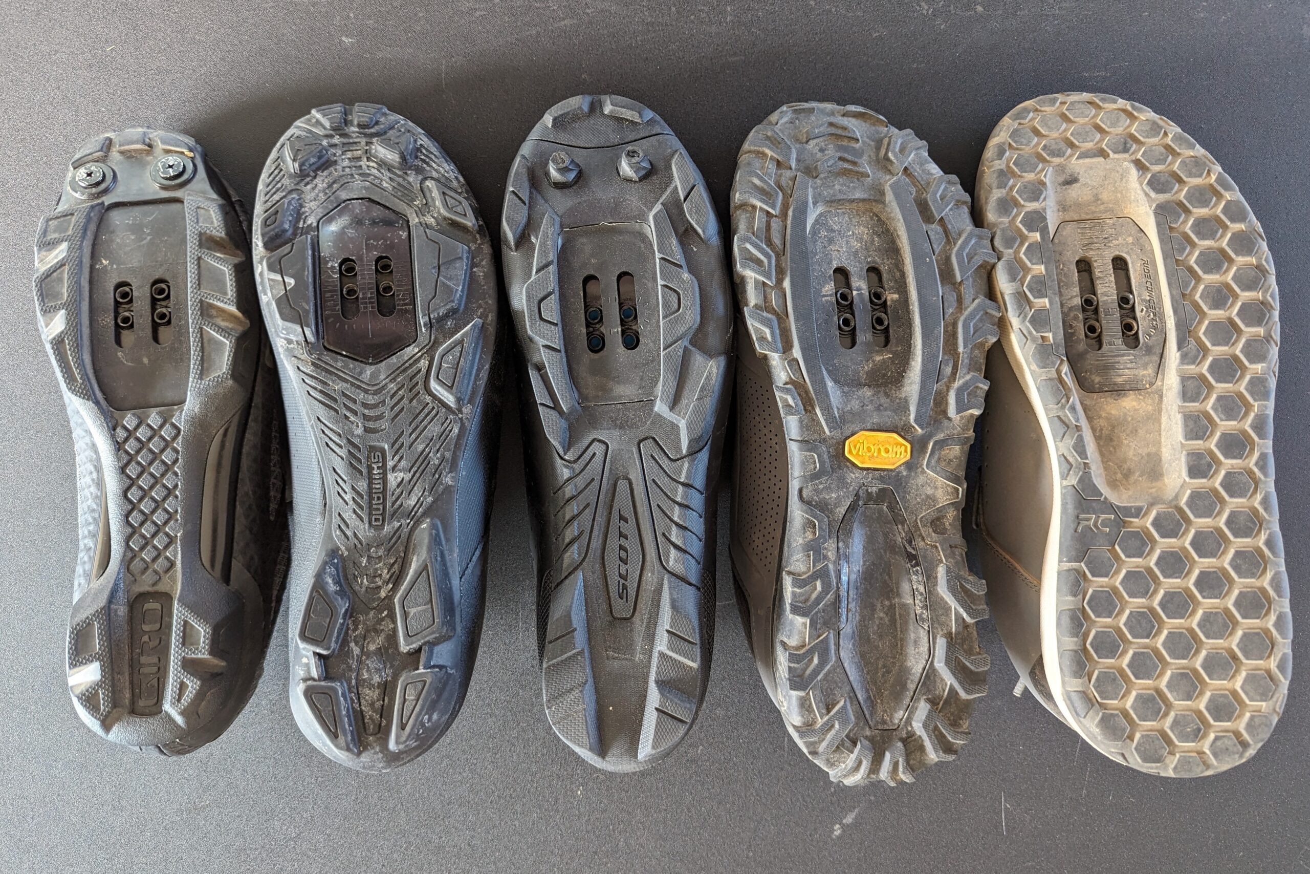 Comparison shot of the soles of the clipless women's mountain bike shoe models we tested