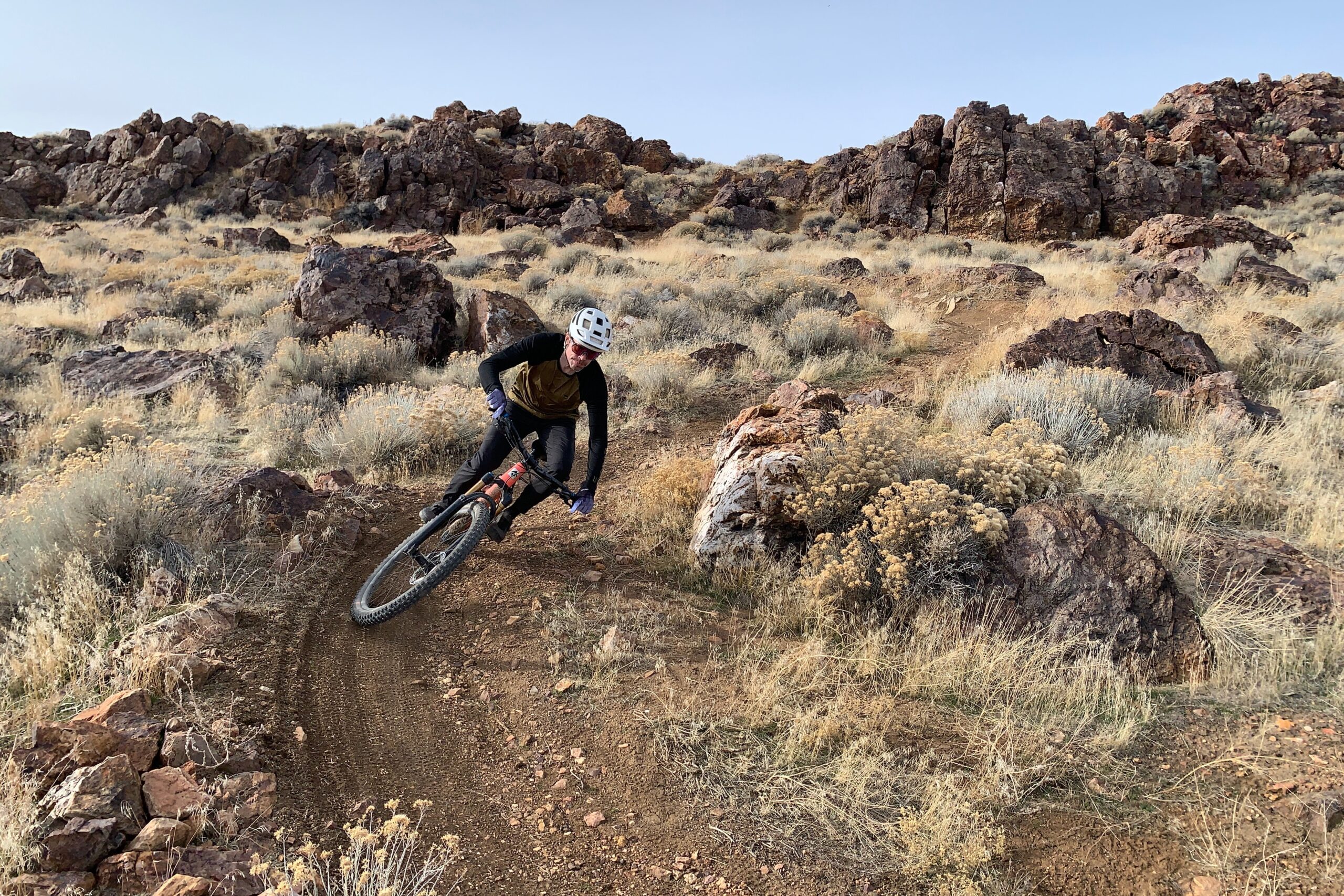Riding a mountain bike on dry trails in conditions well suited to using a dry chain lube