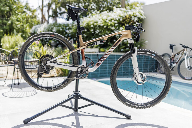 Canyon Lux World Cup CFR Untamed edition, with unreleased 2025 DT Swiss XRC 1200 carbon XC MTB wheels, poolside