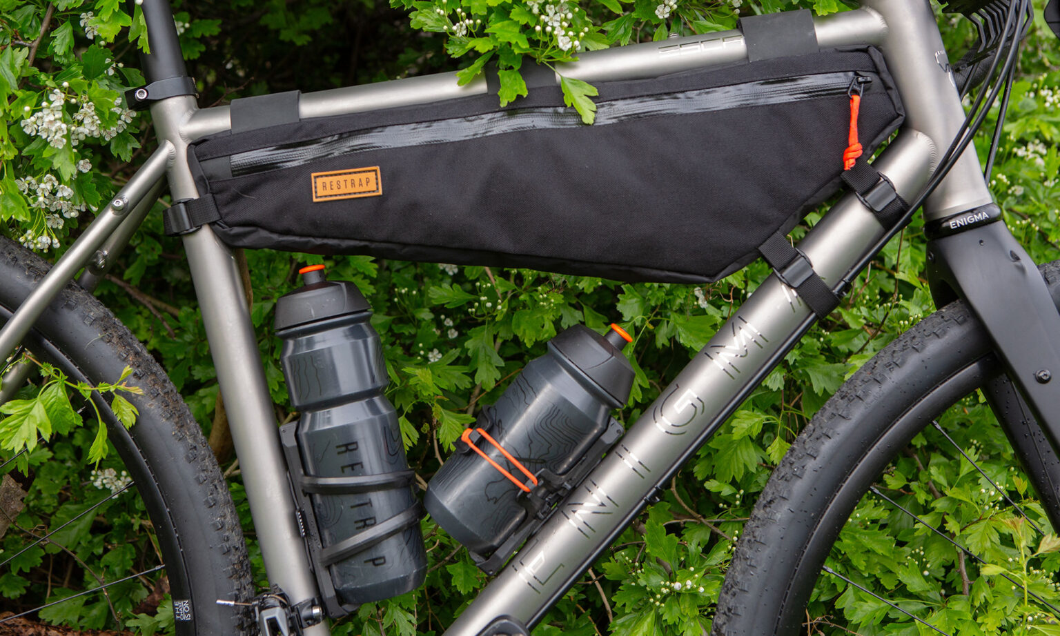 Restrap Side Release water bottle cages, loaded and secure on the bike