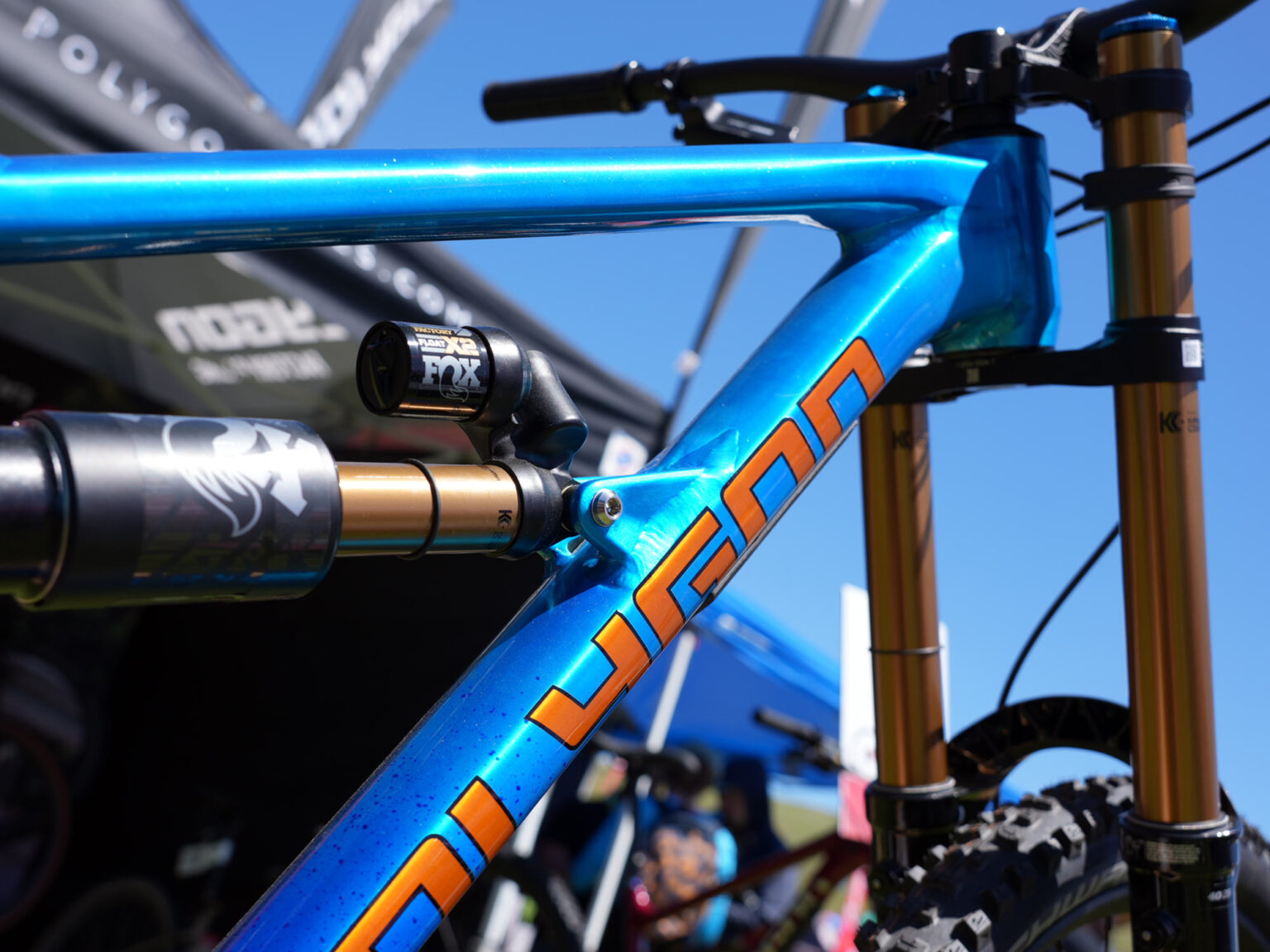 closeup details of blue anodized polygon collosus DH9 alloy downhill mountain bike