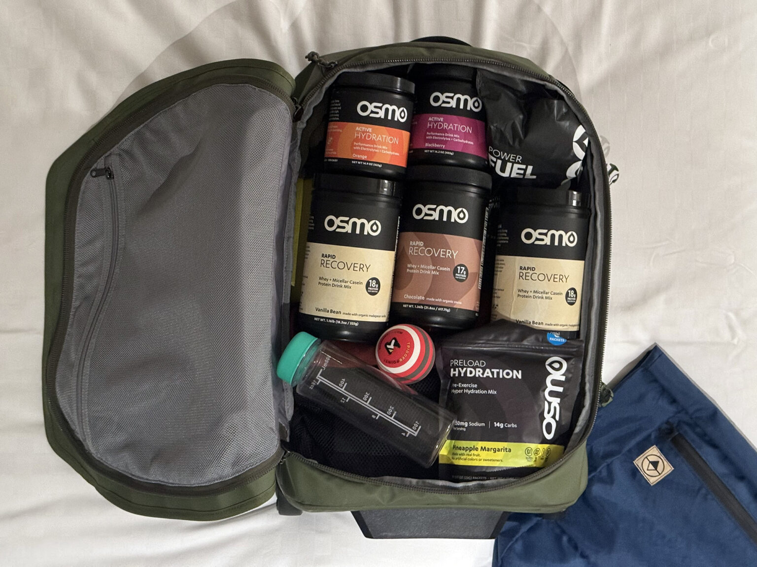 osmo nutrition products in a suitcase.