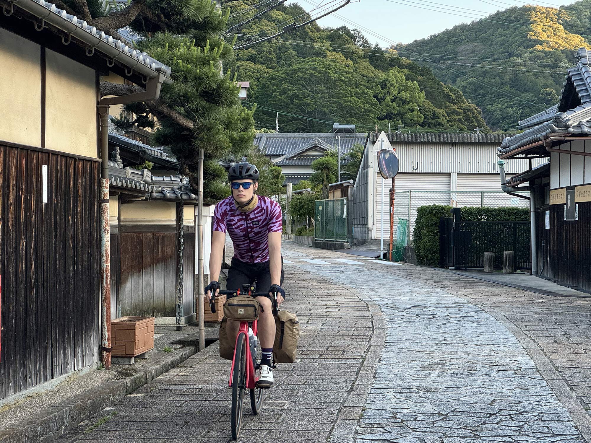 cyclist in japan riding in gore cycling kits.