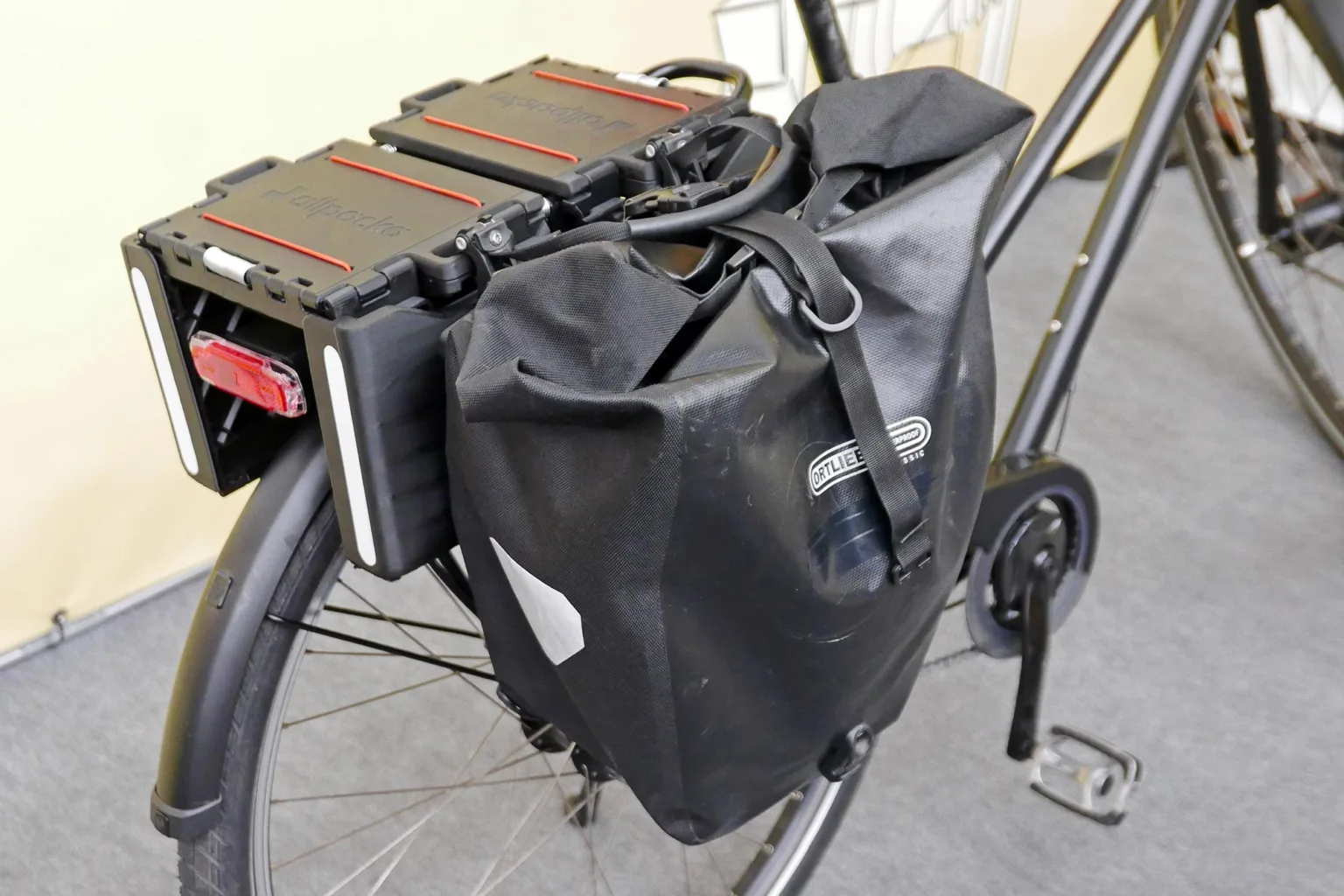 Allpacka One folding commuter bike rack cargo basket, with a pannier bag too