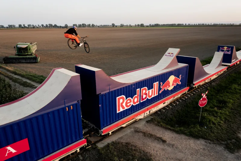 Dawid Godziek Rides on Top of a Moving Train, Creating Wild ‘Freeze Frame’ Visual Effect