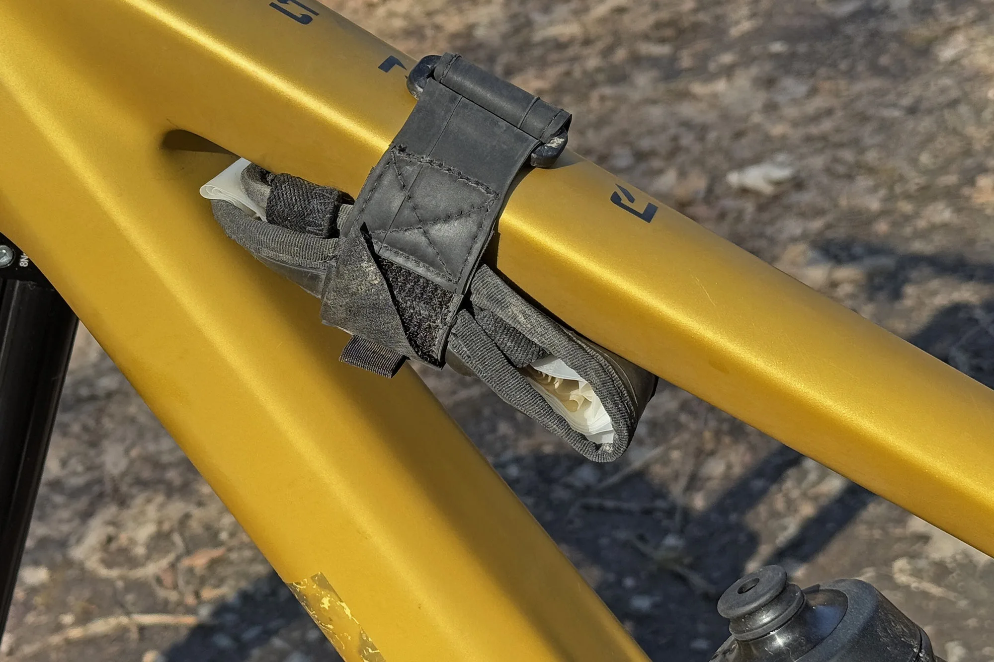 Fix Mfg Tube Terminal frame strap for tools & spares, made from recycled inner tubes, under a mountain bike toptube