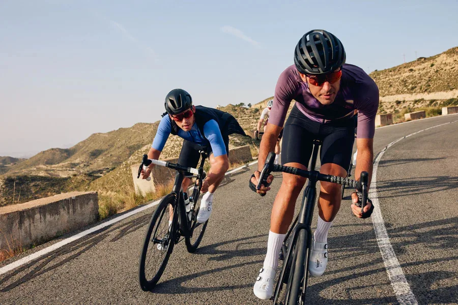 Two riders descend in the desert wearing Shimano S-Phyre road apparel