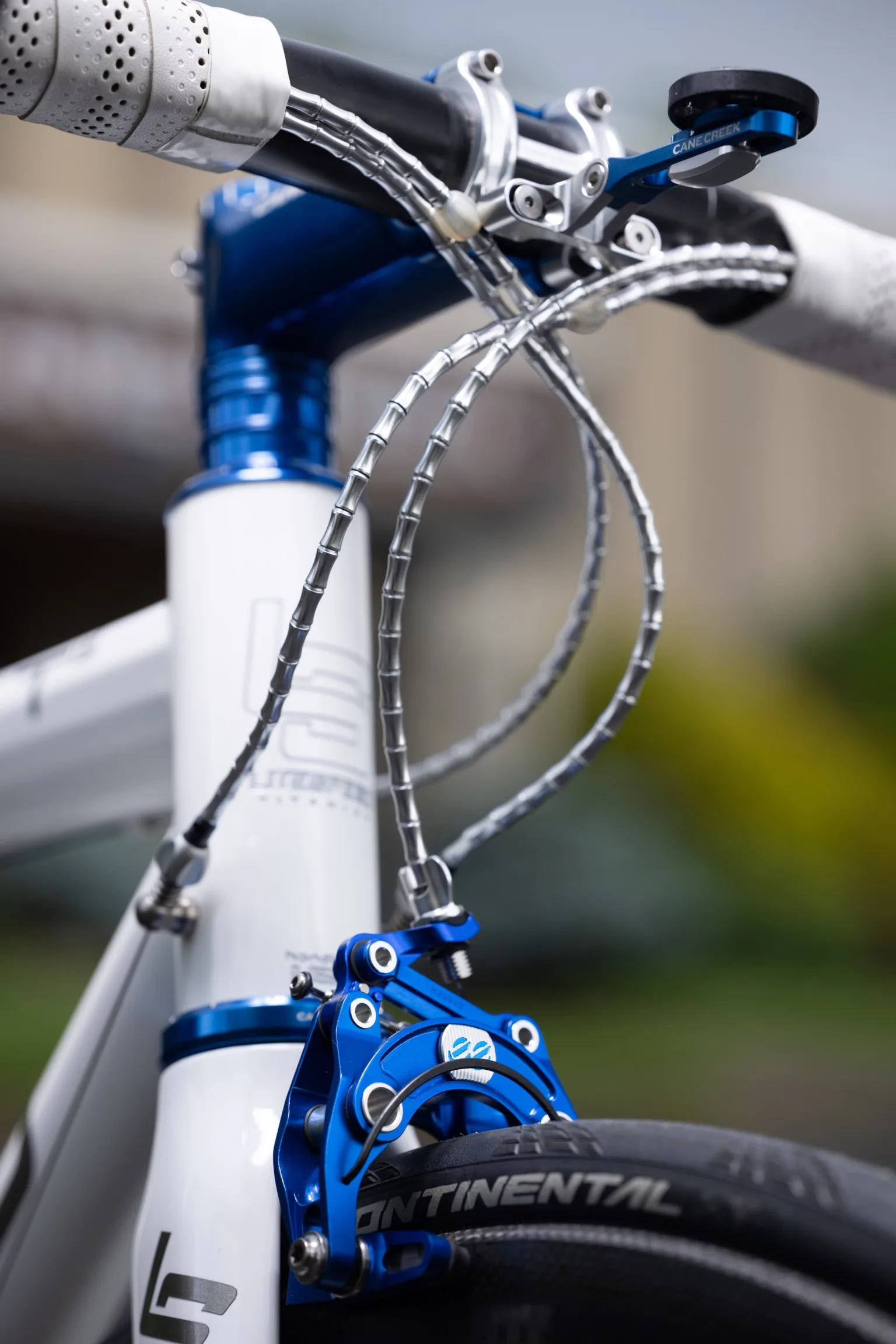 30th Anniversary Collection brakes, headset, stem, and computer mount on a Litespeed road bike.