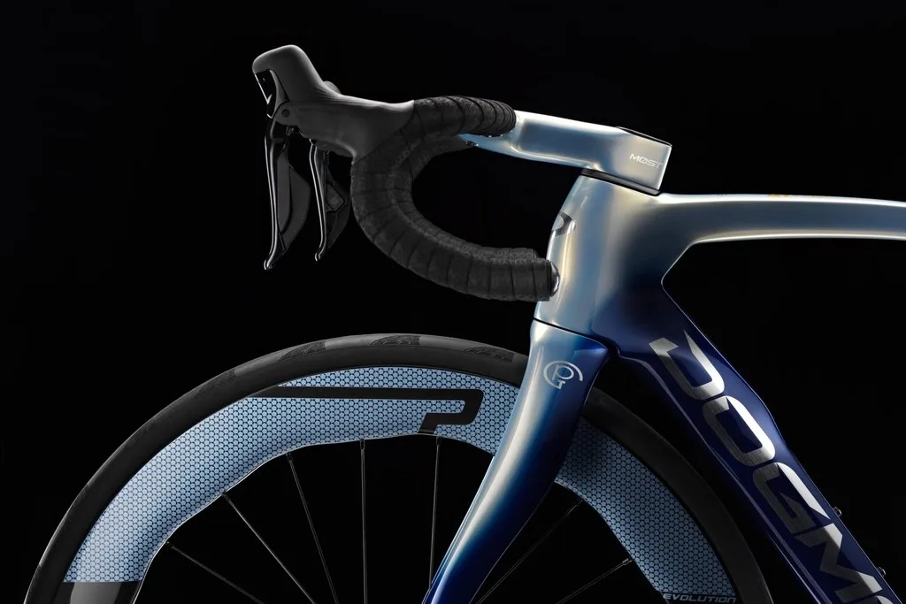 Side view of the cockpit, head tube, fork, and custom painted wheels on the Special Edition Pinarello Dogma F.