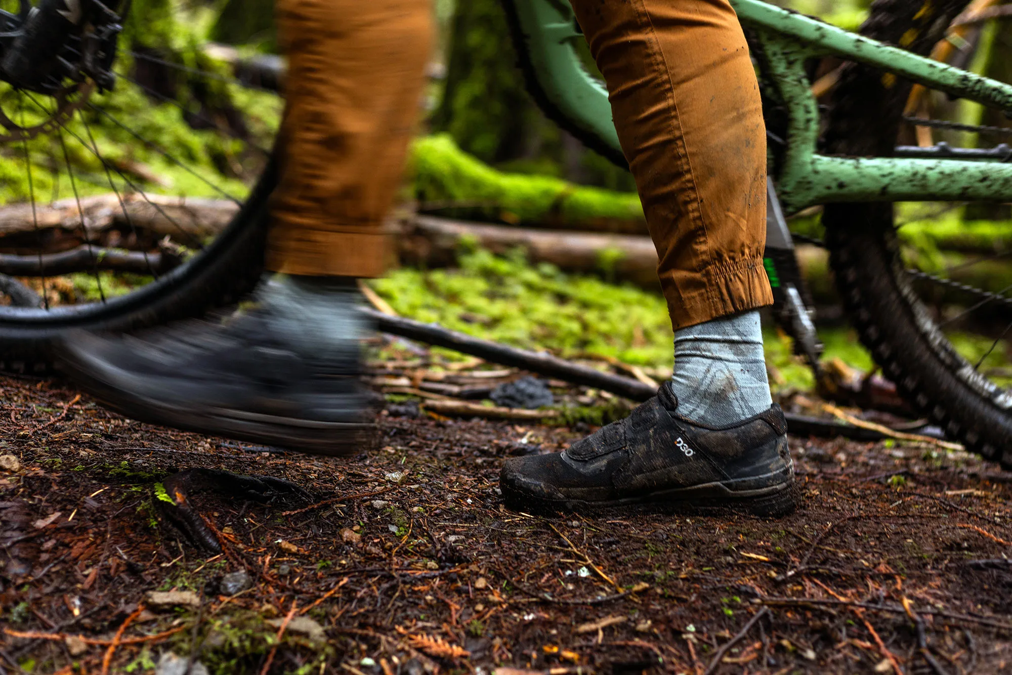person walking in ride concepts hellion boa mountain bike shoes.