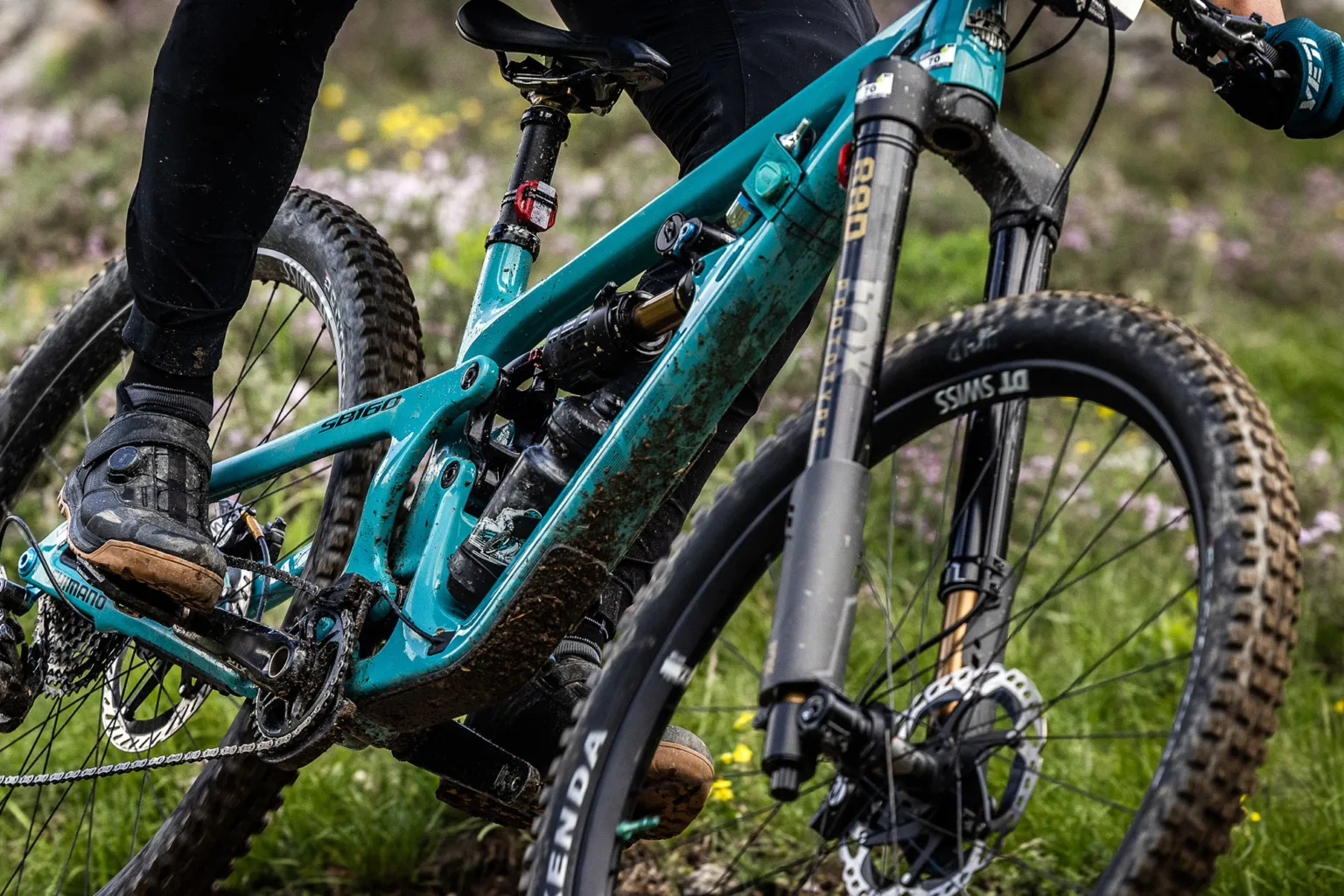 closeup of mountain biker riding the new fox podium inverted enduro fork.