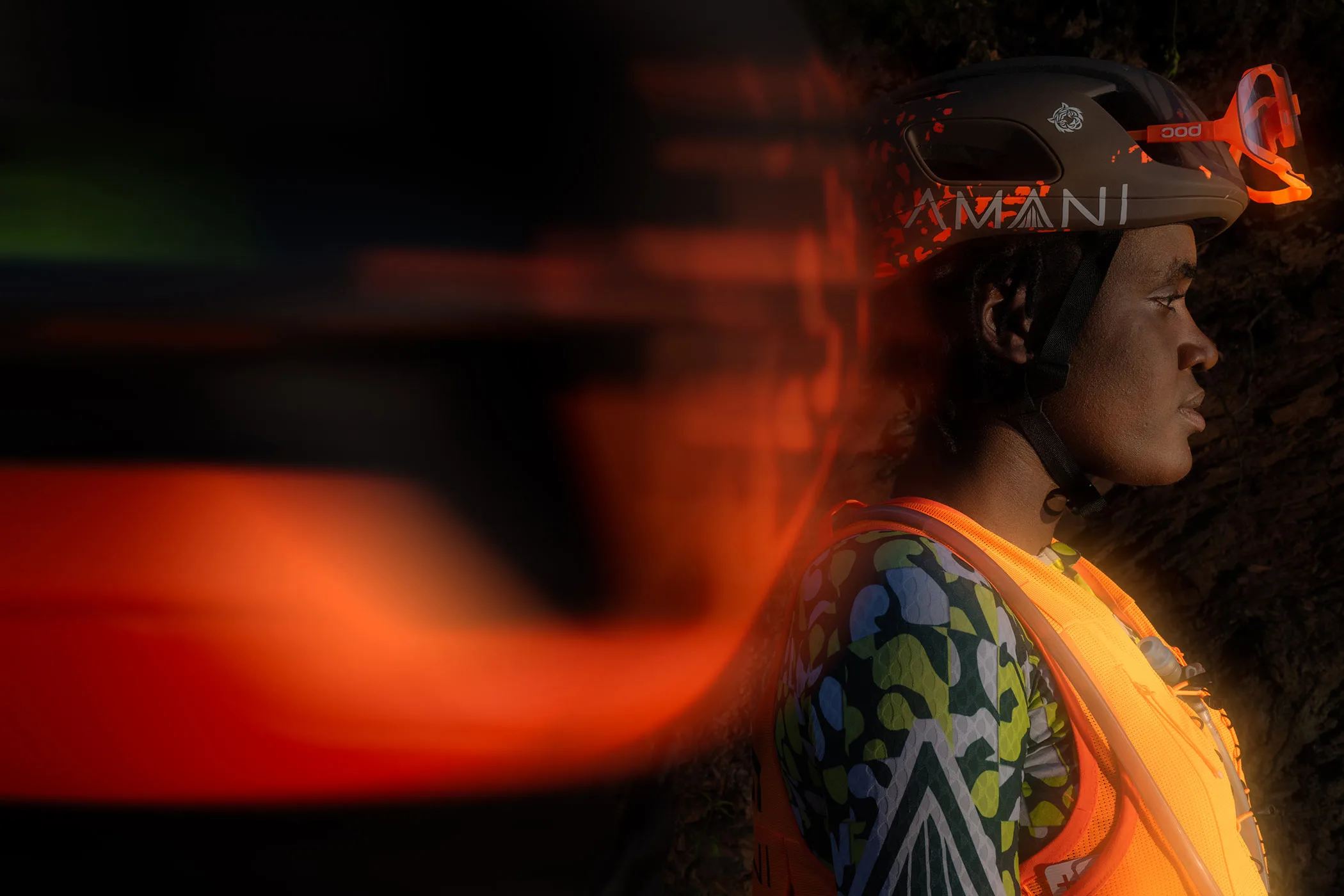 POC x Team Amani collab, all-new Ultra Vest hydration vest and limited edition Cytal aero road helmet for gravel ultra cycling racing, side profile blur