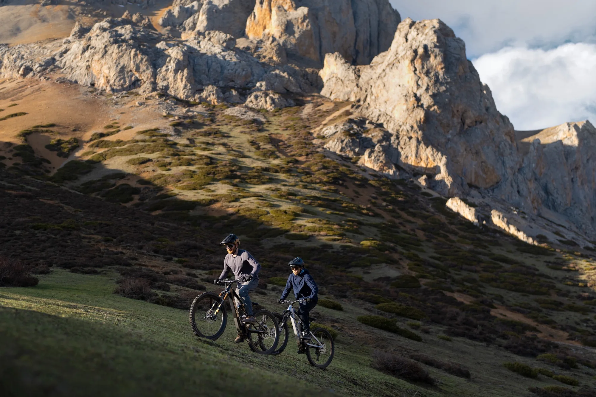 Two riders climbing a hill on the Amflow PL carbon bikes.