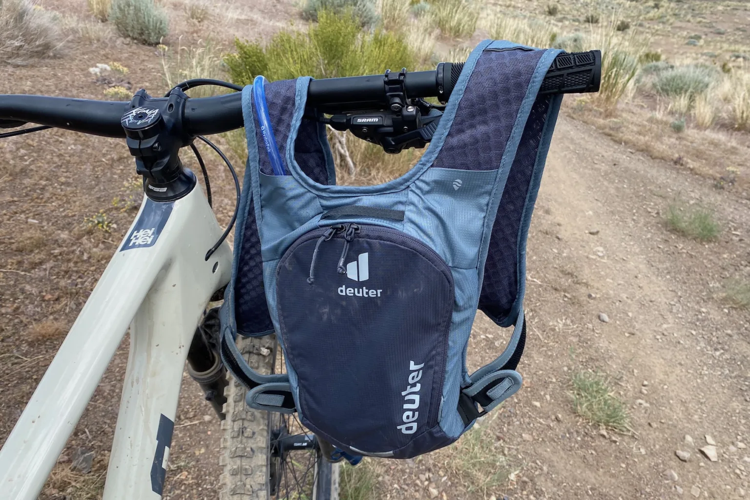 The Deuter Rogla 5 hanging from a handlebar while on a test ride.