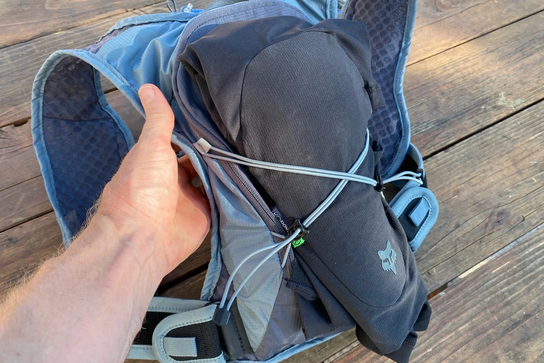 A set of knee pads strapped to the outside of the Rogla 5