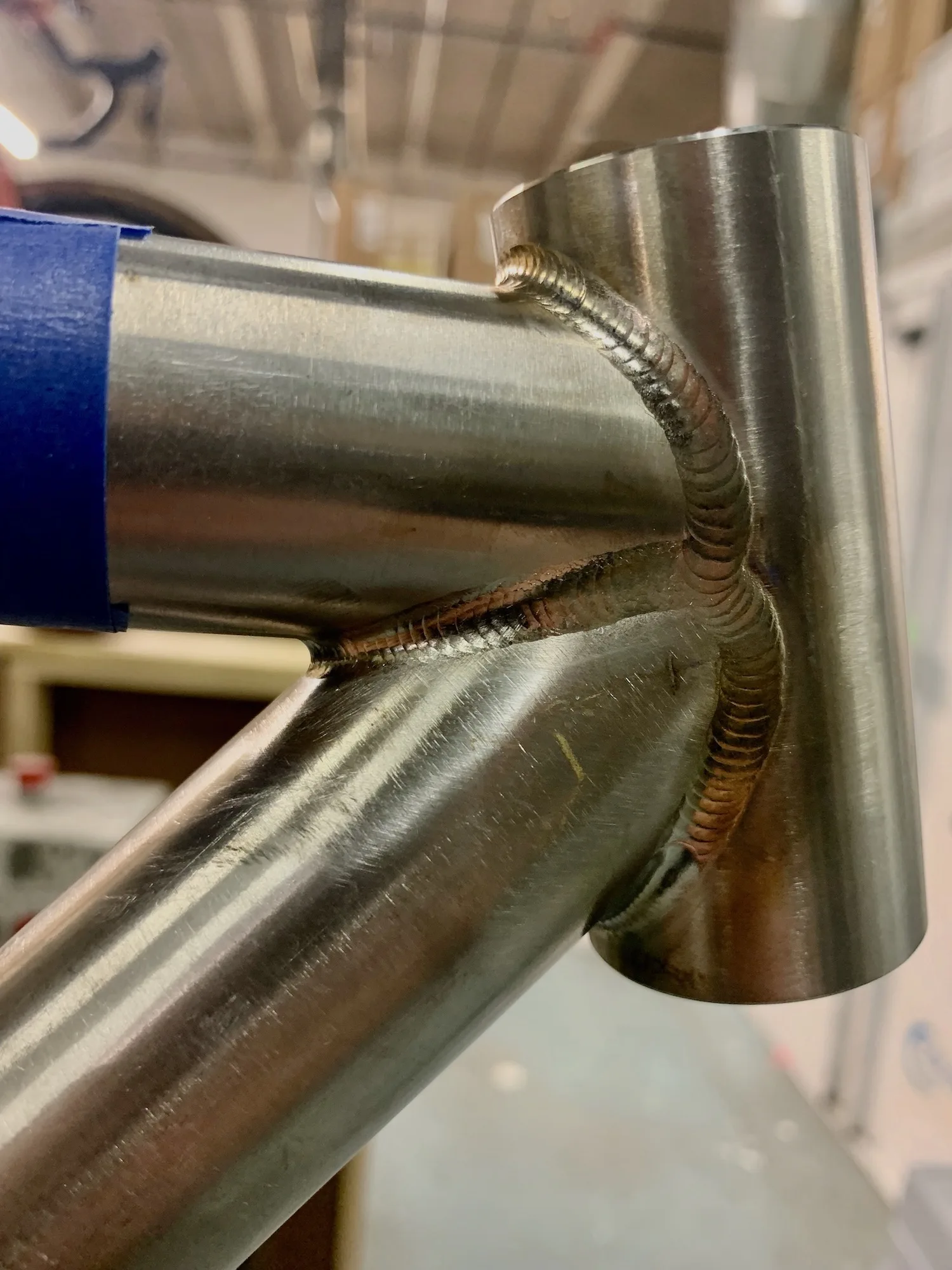 detail shot of perfect welds on the head tube of one of Ari's frames.