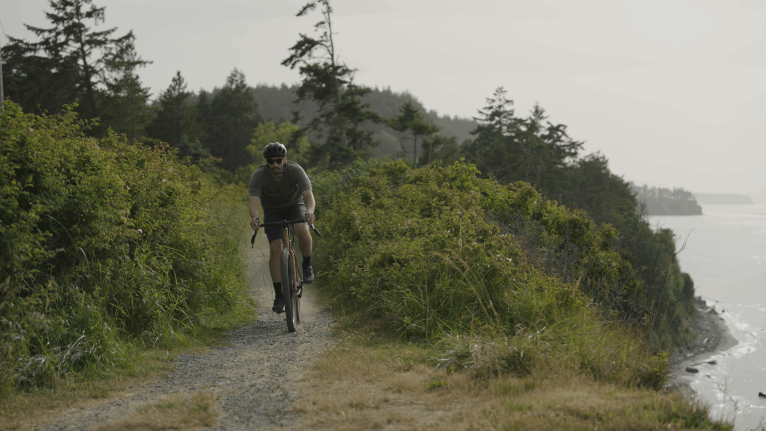 a Pine Cycles FRST rider on a costal trail