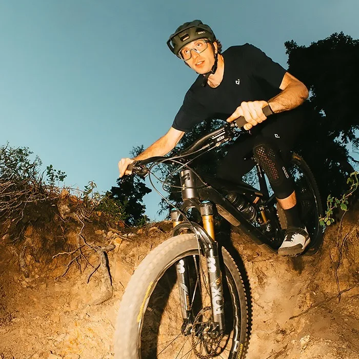 A person riding in the new Giro Montaro Mips III.
