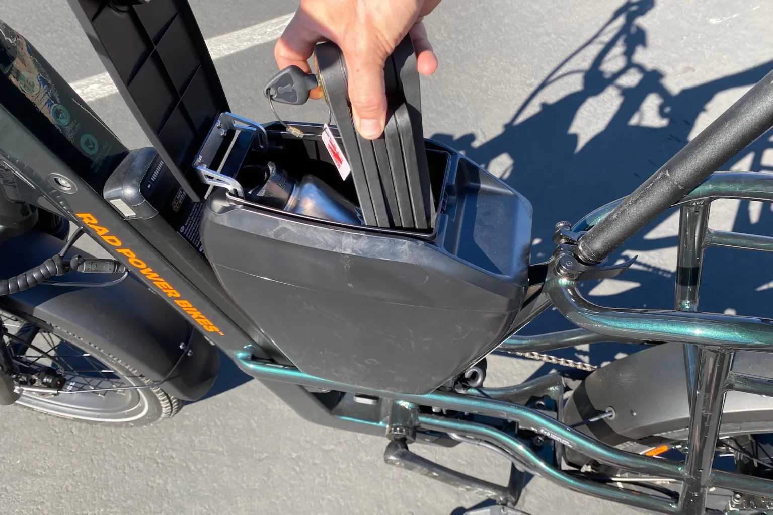 pulling a bike lock out of the console on the radrunner