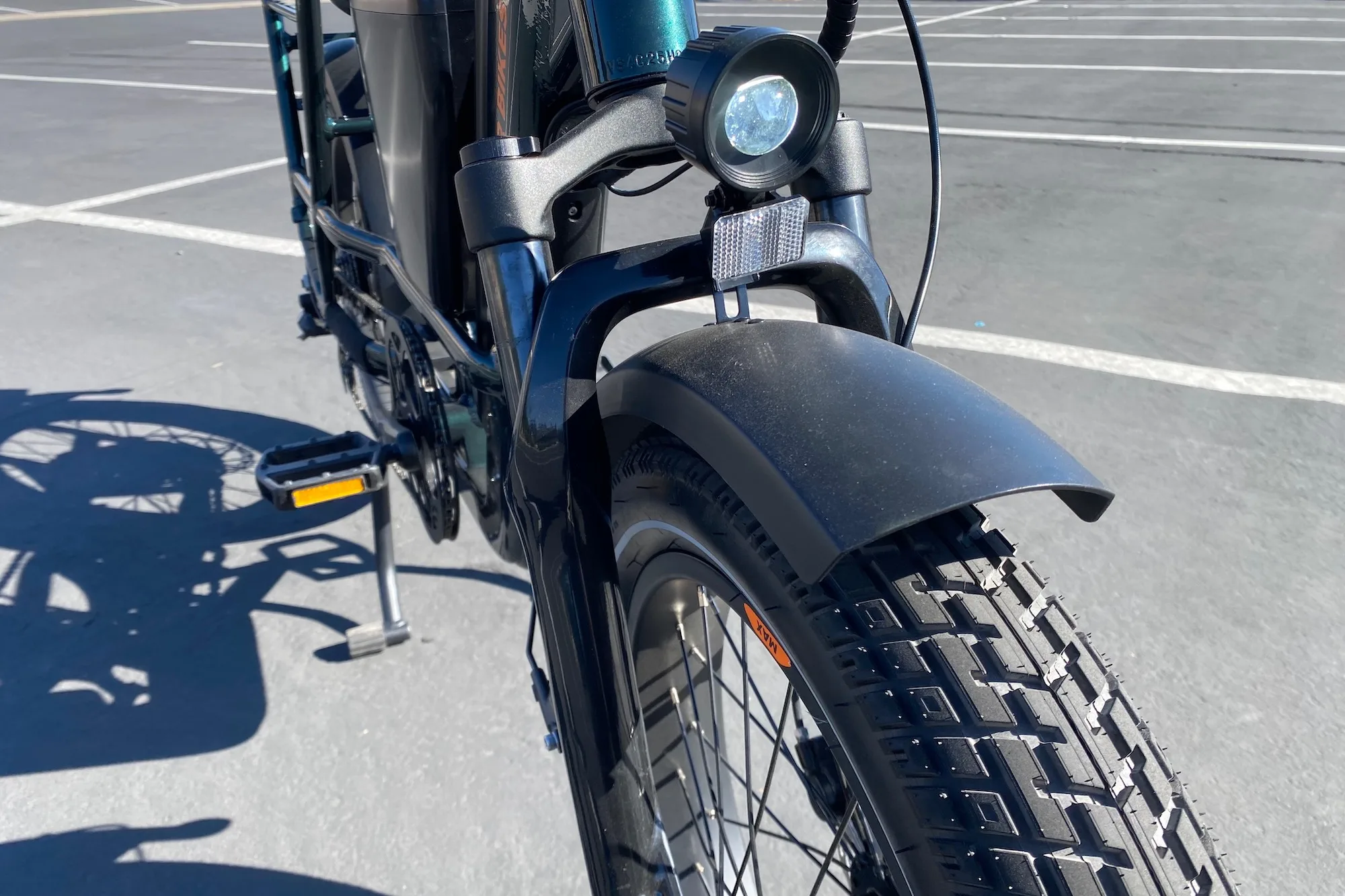 the suspension fork, headlight, fender, and front tire on the radrunner max