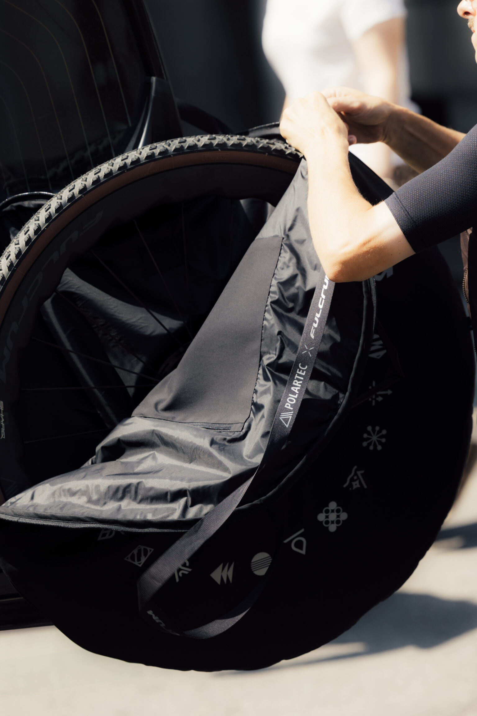 zipping up Polartec wheel bag