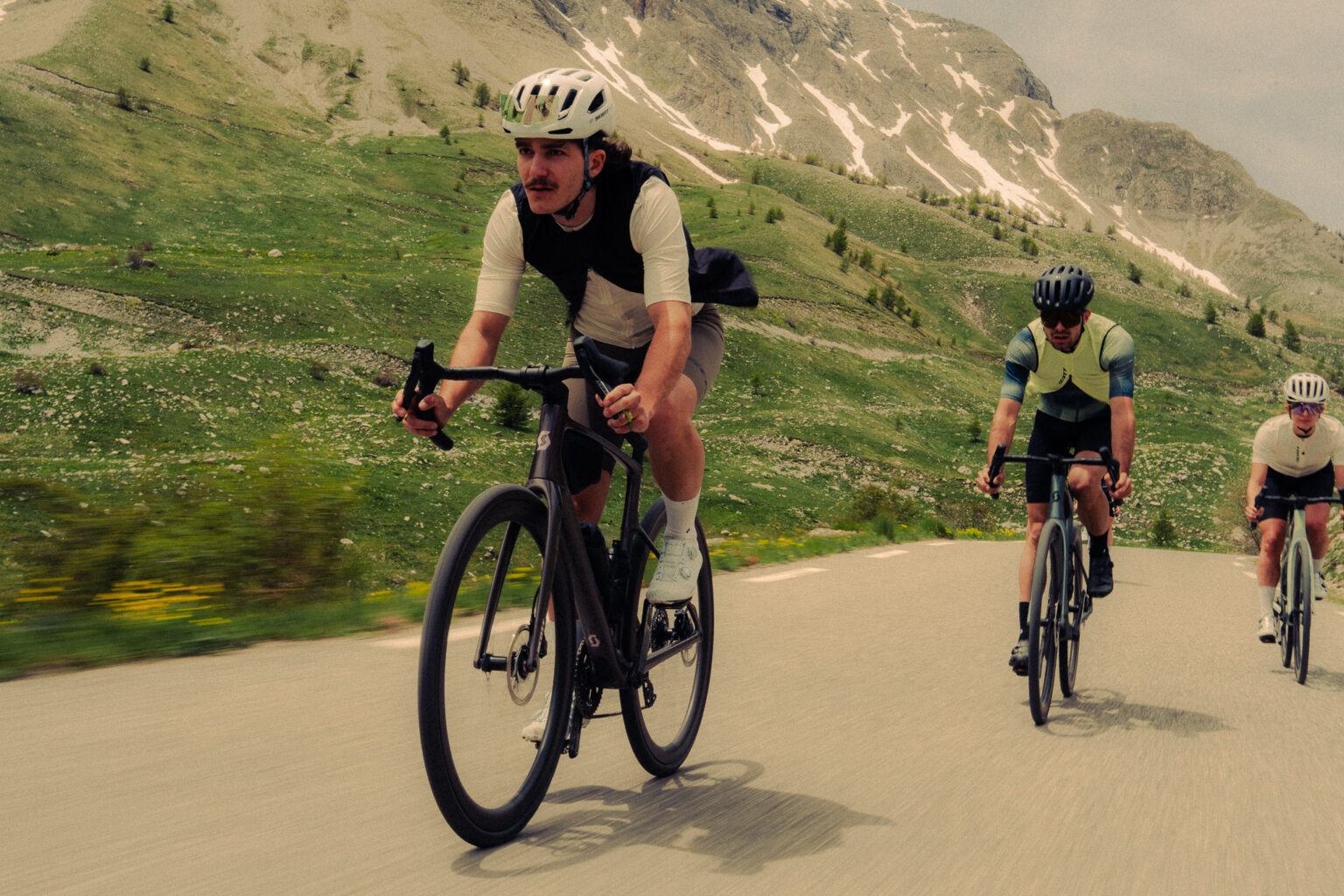 a group riding through the mountains on the new Scott Addict road bike